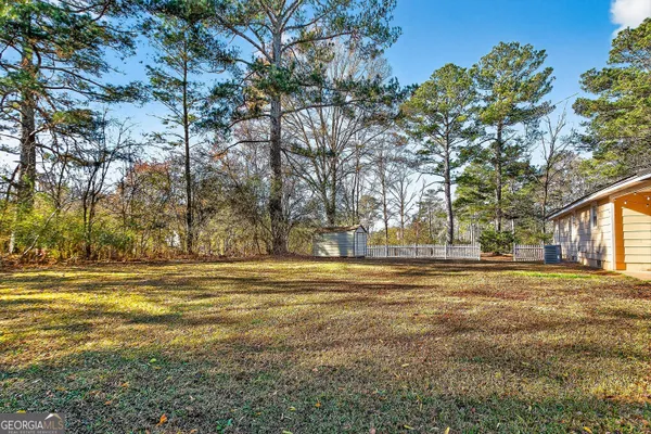 a view of a field with a trees