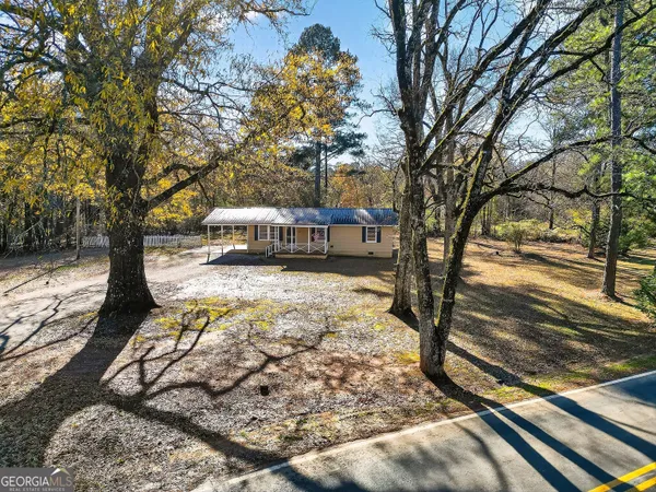 a view of a yard with trees