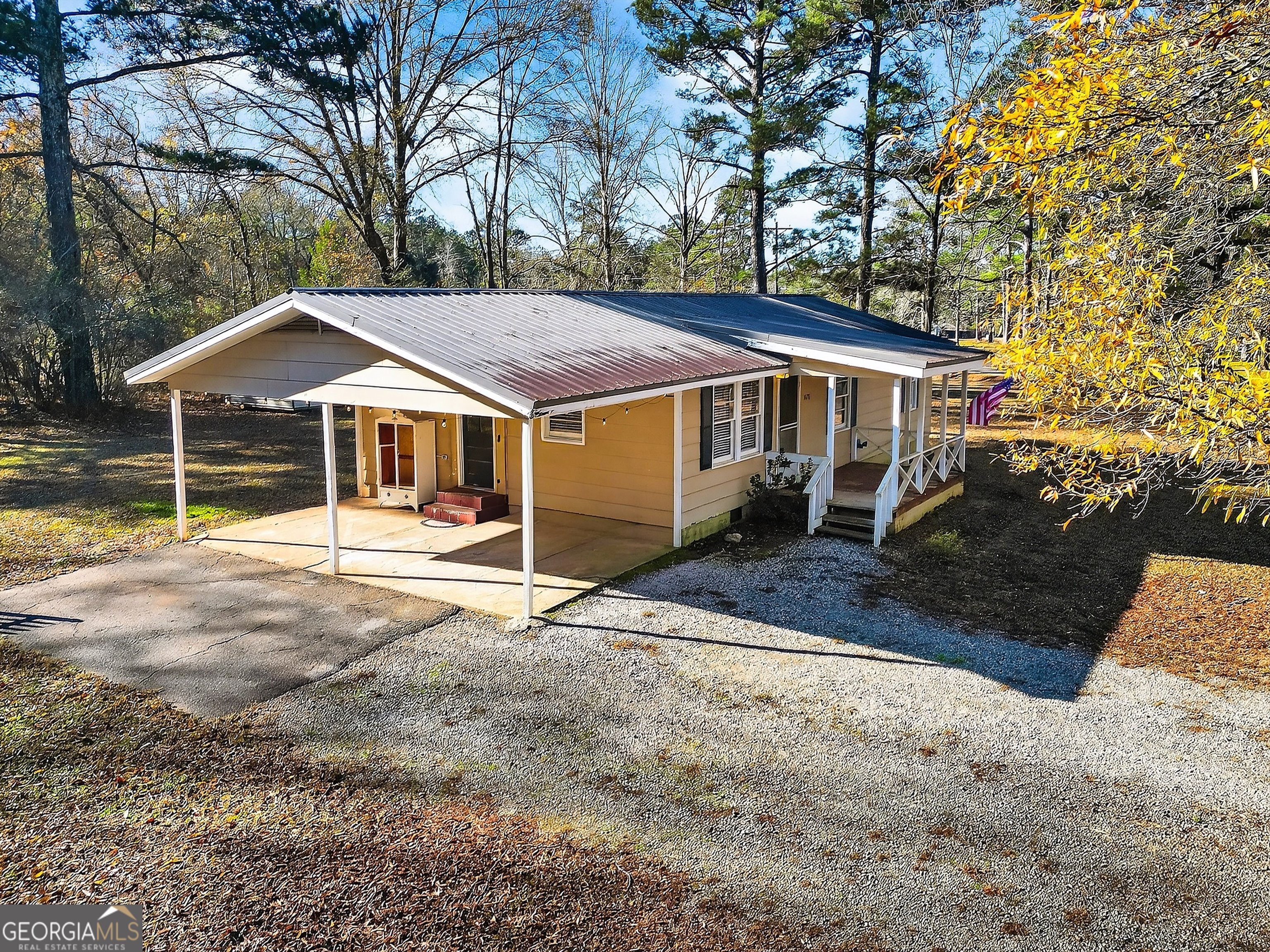 1470 Melville Brown Road Williamson, GA 30292 - Photo 30 of 36 a house with trees in the background