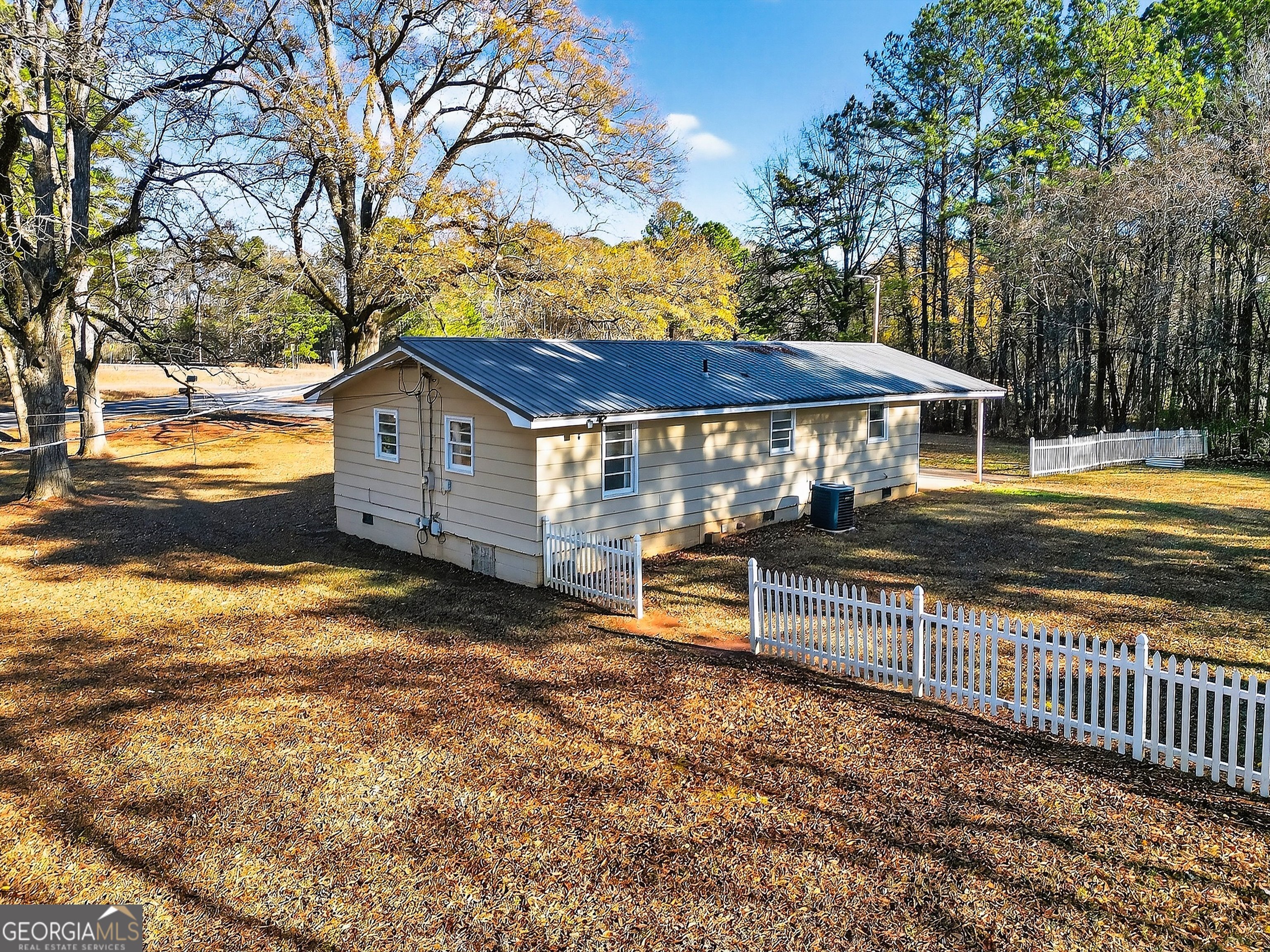 1470 Melville Brown Road Williamson, GA 30292 - Photo 32 of 36 a view of a house with backyard and sitting area