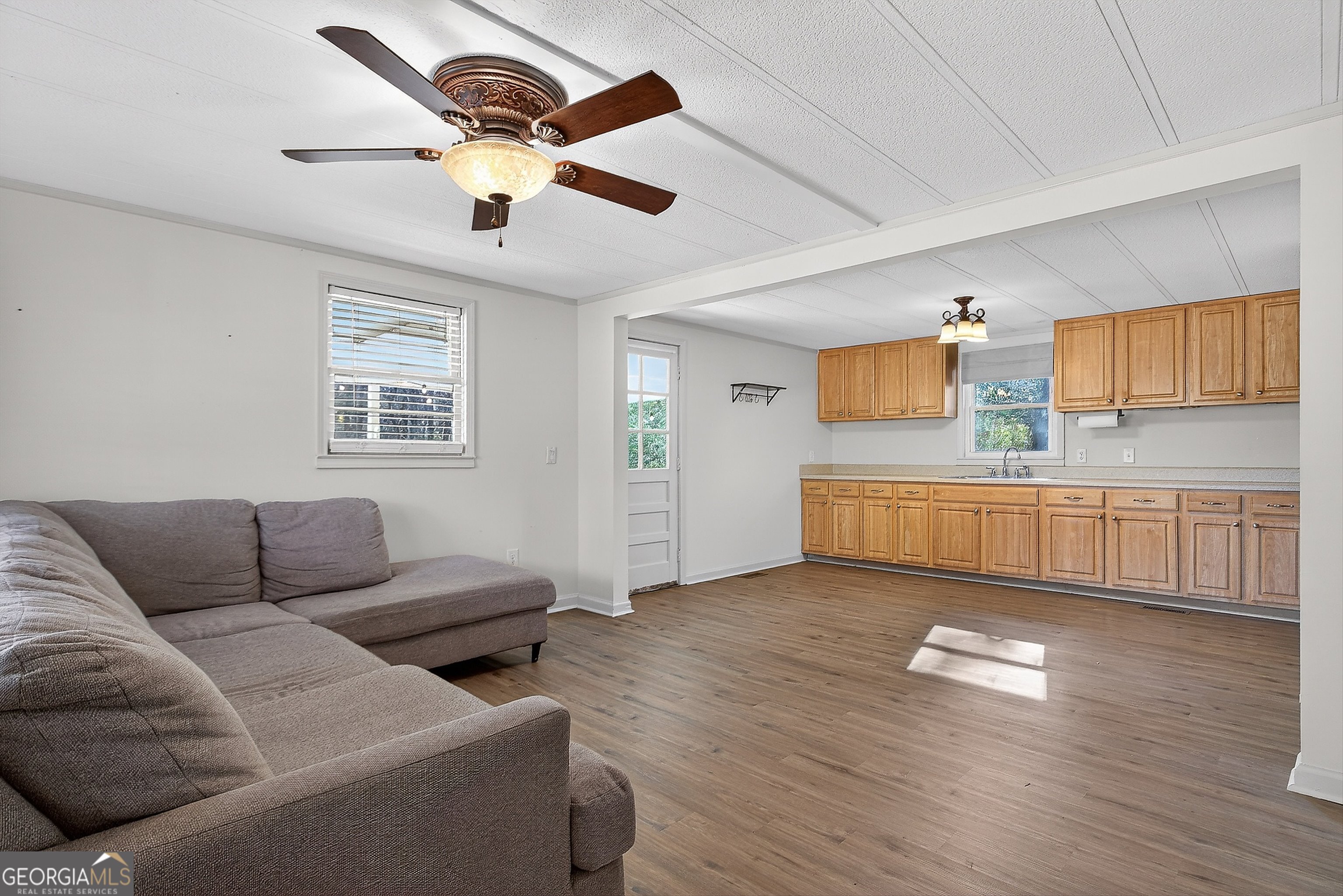 1470 Melville Brown Road Williamson, GA 30292 - Photo 5 of 36 a living room with furniture and kitchen view