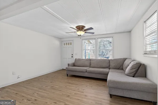 a living room with furniture and a large window