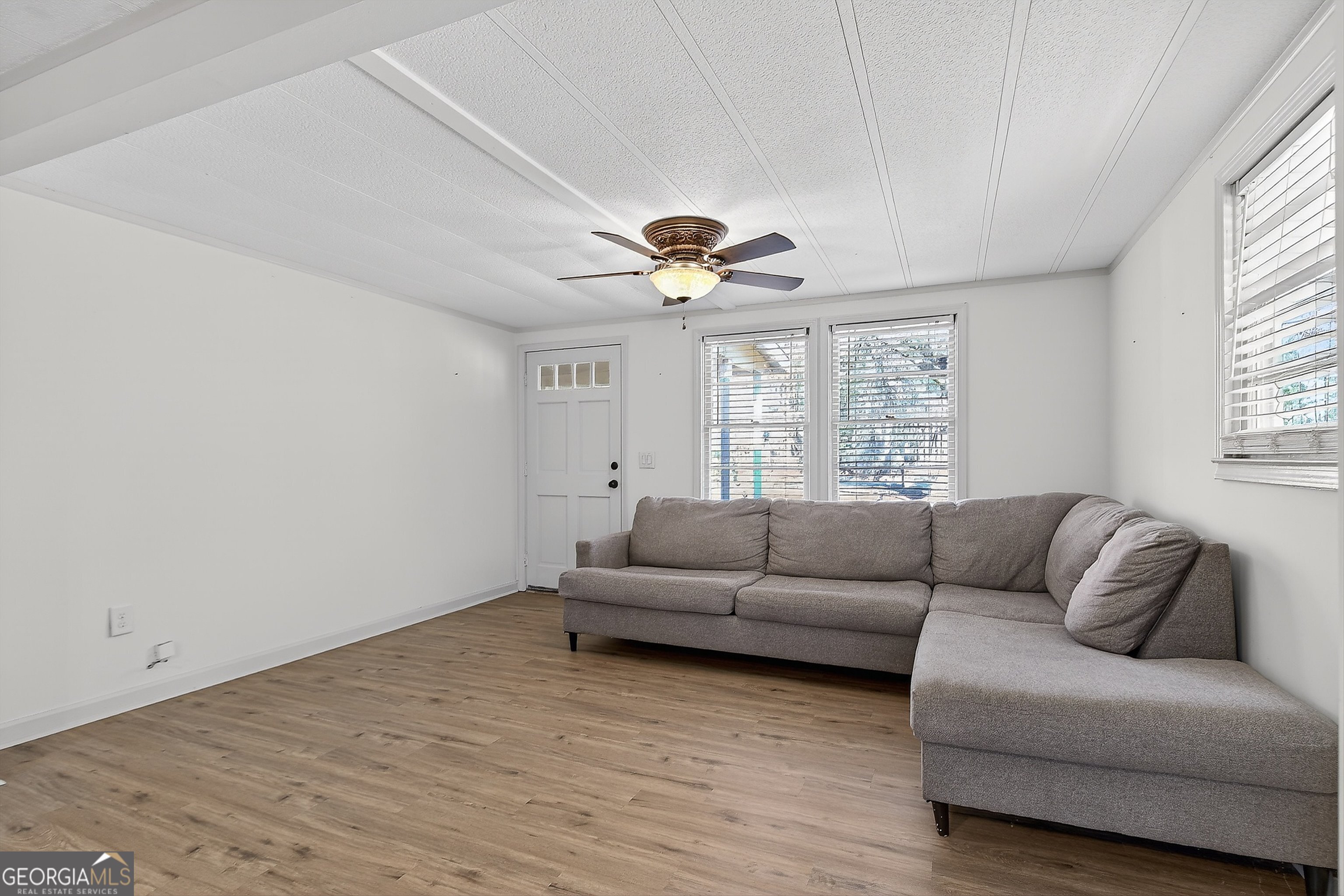 1470 Melville Brown Road Williamson, GA 30292 - Photo 6 of 36 a living room with furniture and a large window