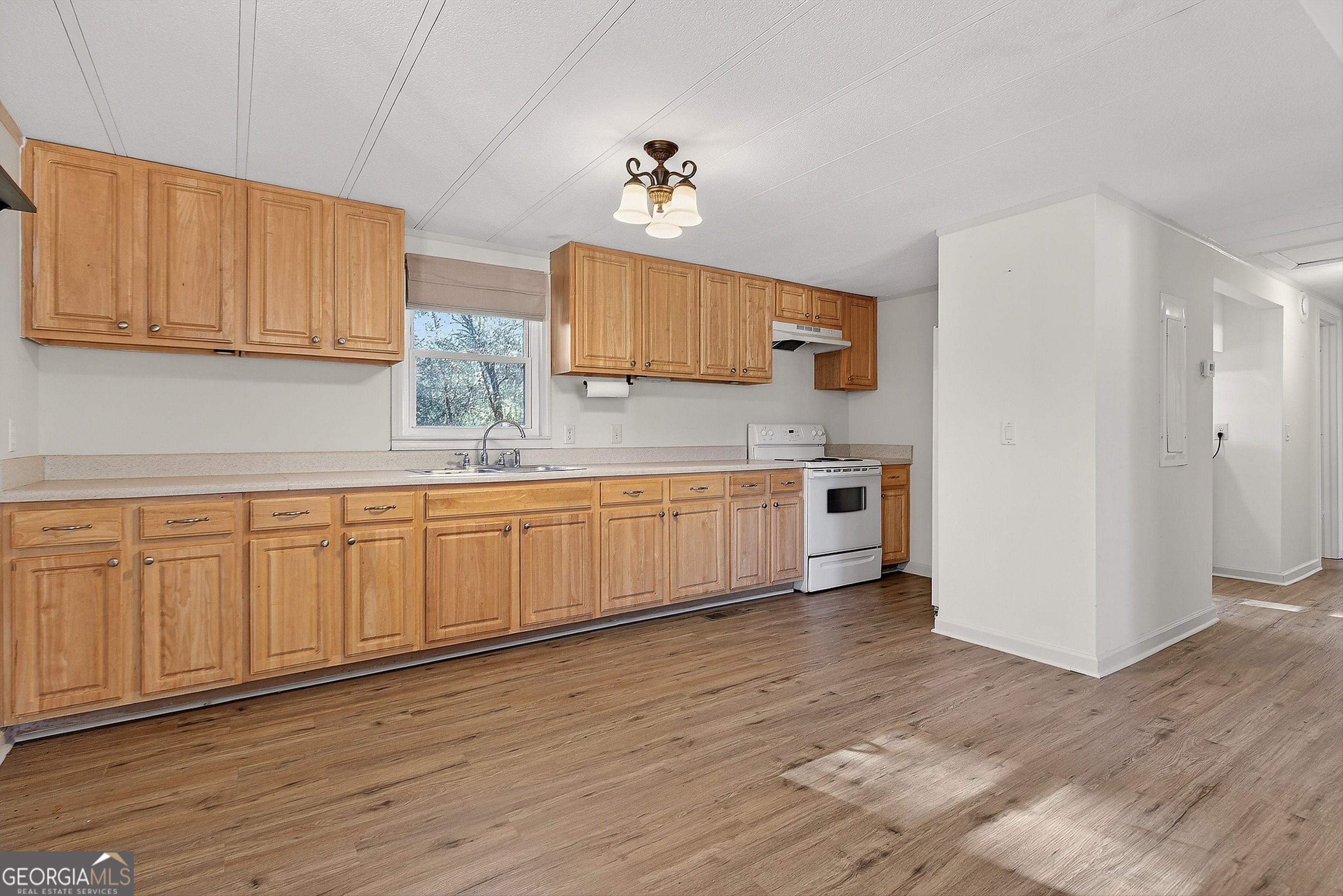 1470 Melville Brown Road Williamson, GA 30292 - Photo 7 of 36 a kitchen with white cabinets white stainless steel appliances and sink