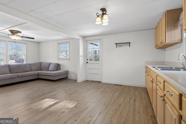 a view of a livingroom with furniture and wooden floor