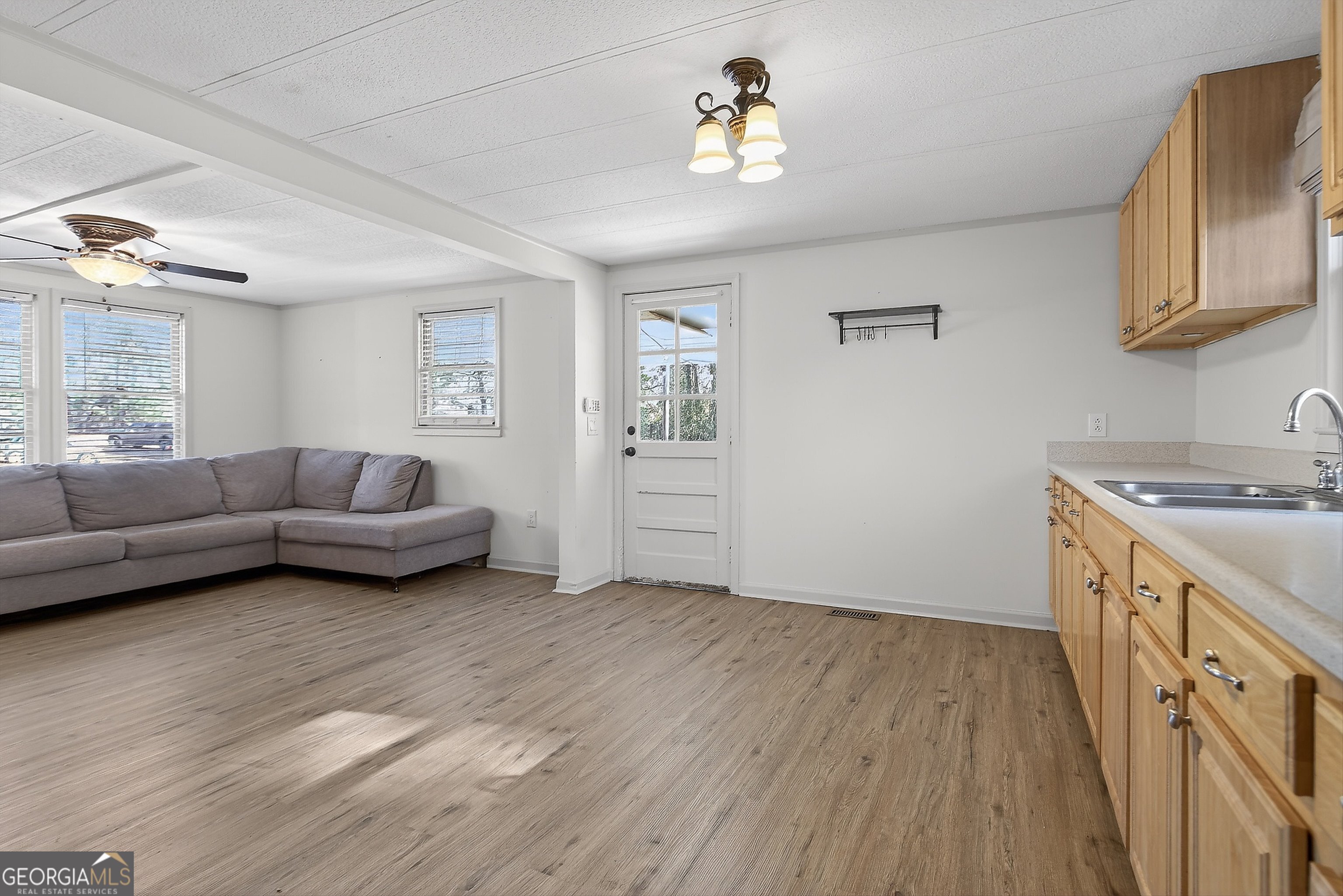 1470 Melville Brown Road Williamson, GA 30292 - Photo 8 of 36 a view of a livingroom with furniture and wooden floor