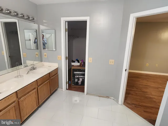 a room with a piano and wooden floor