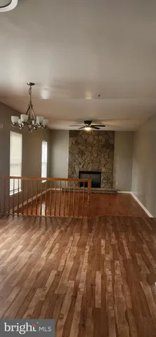 a kitchen with stainless steel appliances kitchen island granite countertop a stove a sink and a microwave