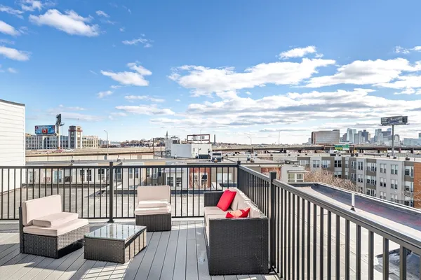 a view of a balcony with wooden floor