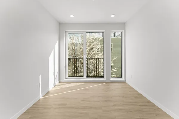 a view of an empty room with a window