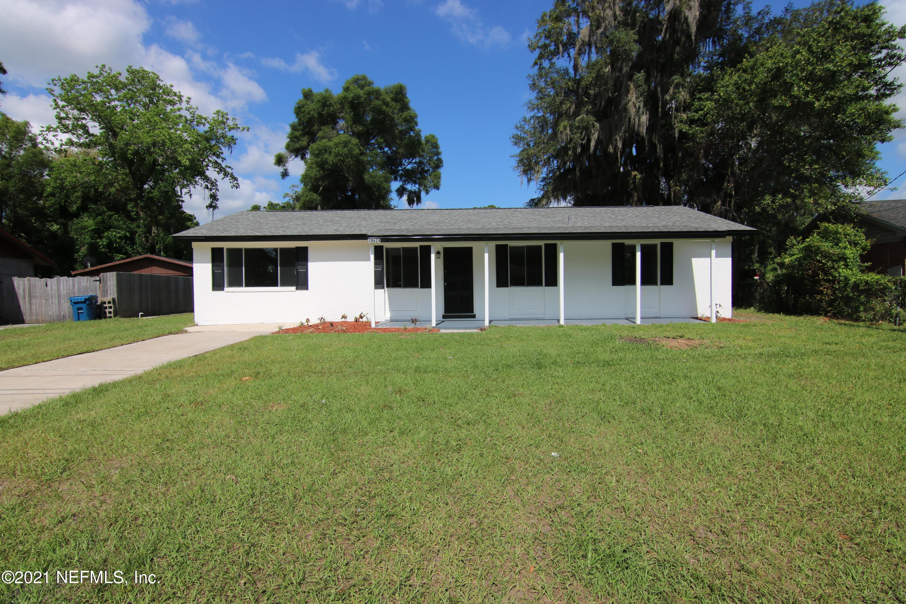 10624 Dodd Road Jacksonville, FL 32218 - Photo 1 of 21 a front view of house with yard and green space
