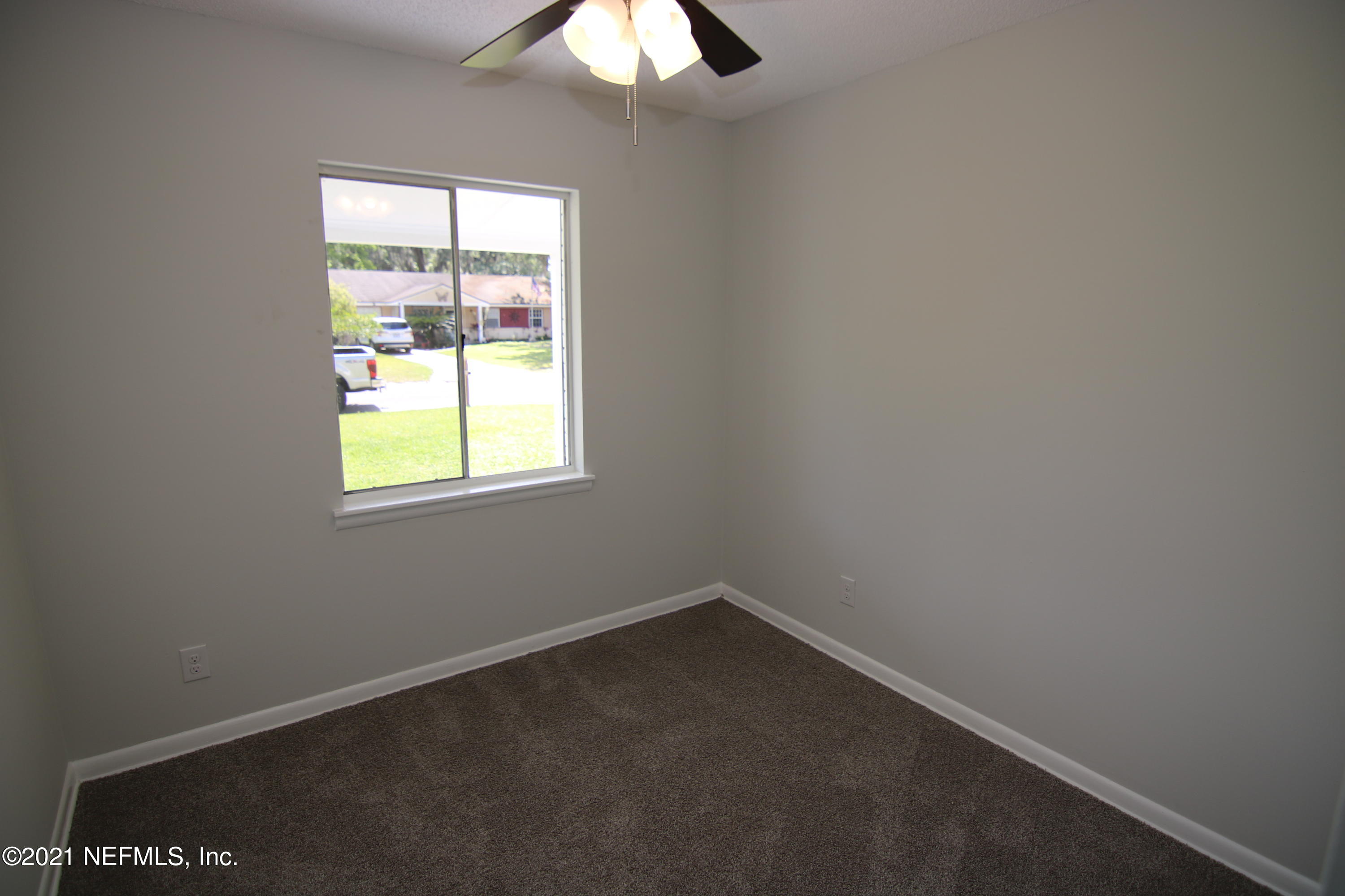 10624 Dodd Road Jacksonville, FL 32218 - Photo 15 of 21 an empty room with a window