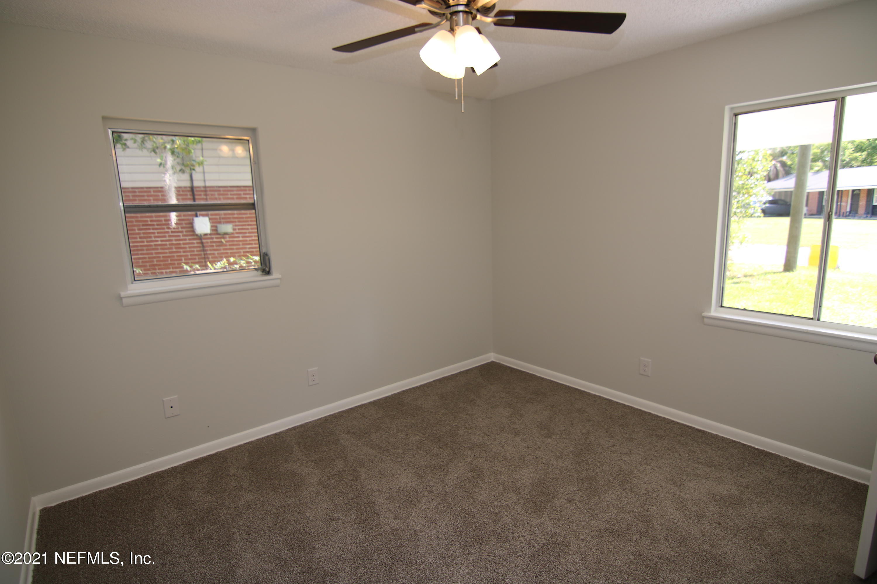 10624 Dodd Road Jacksonville, FL 32218 - Photo 18 of 21 an empty room with a window