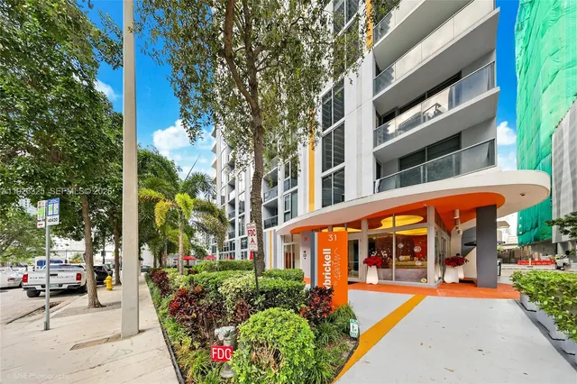 a view of a lobby with furniture and a large window