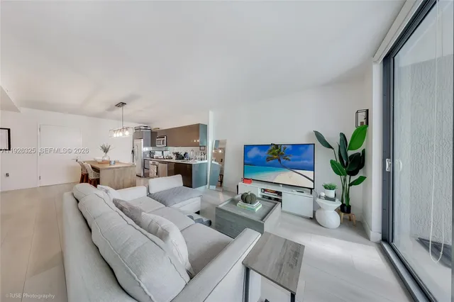 a kitchen with a sink a stove a refrigerator and cabinets