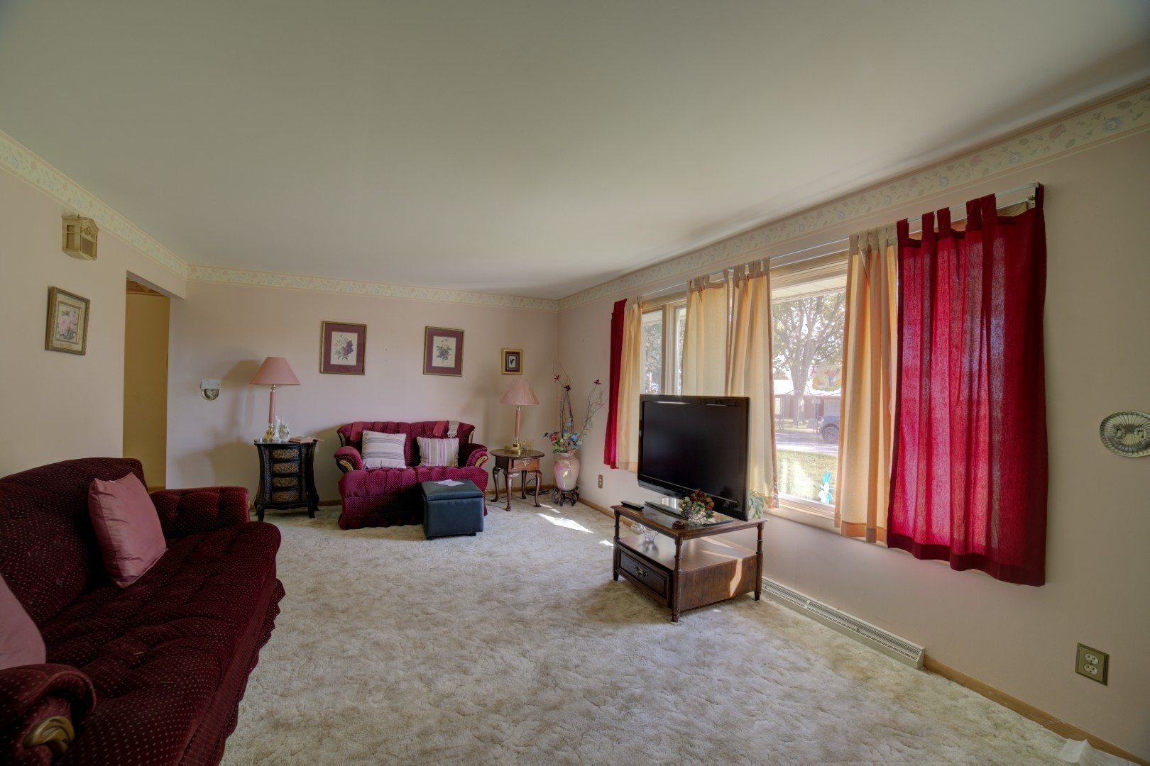 405 Deitrick Street Donovan, IL 60931 - Photo 16 of 29 a living room with furniture a flat screen tv and a window