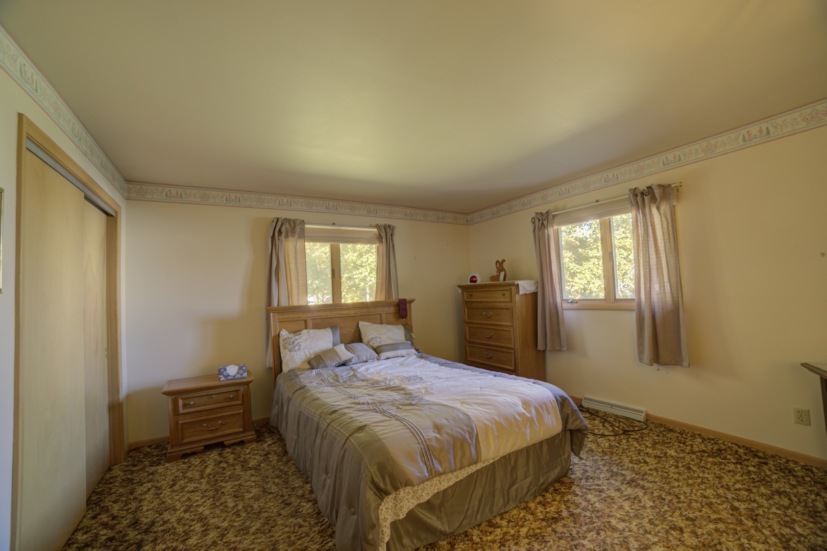 405 Deitrick Street Donovan, IL 60931 - Photo 20 of 29 a bedroom with a bed and wooden floor