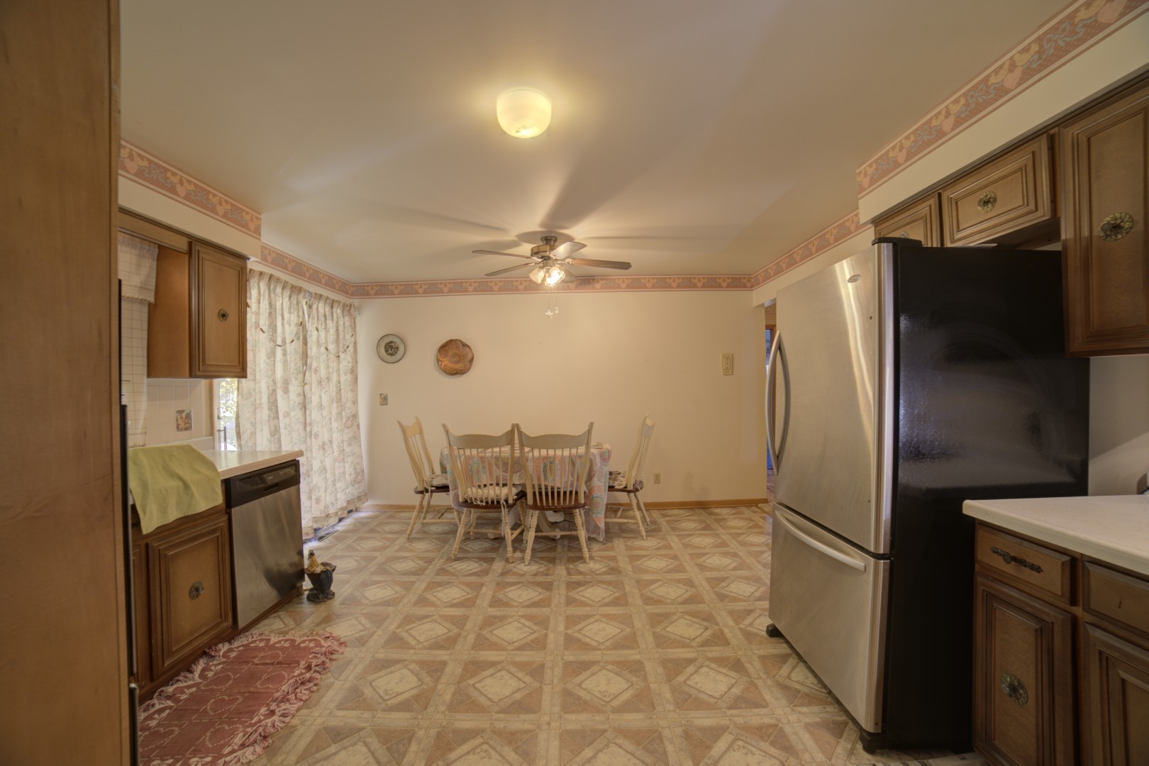 405 Deitrick Street Donovan, IL 60931 - Photo 9 of 29 a kitchen with stainless steel appliances a refrigerator and a stove top oven