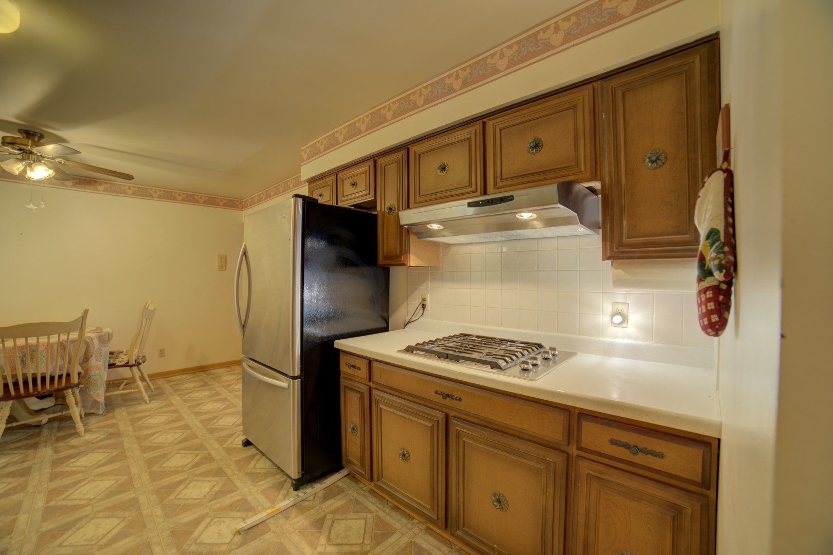 405 Deitrick Street Donovan, IL 60931 - Photo 10 of 29 a kitchen with stainless steel appliances granite countertop a refrigerator and a stove