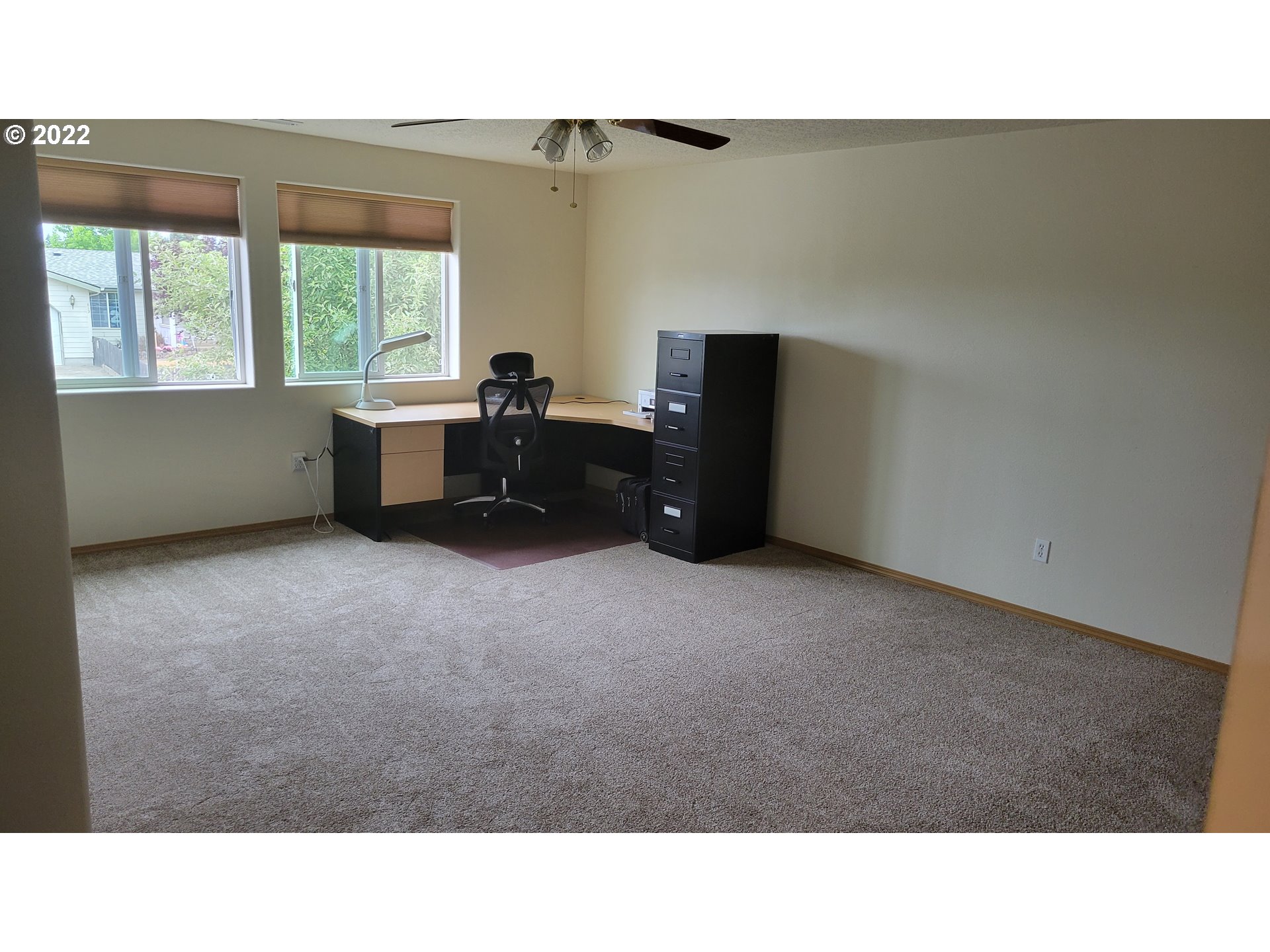 816 Southeast Darrow Road Estacada, OR 97023 - Photo 17 of 29 a open hall with a cabinet and a projector screen