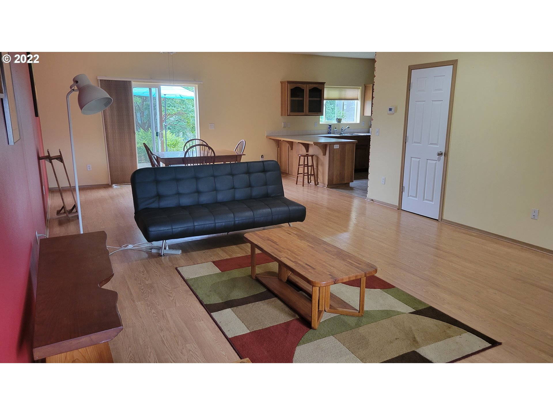 816 Southeast Darrow Road Estacada, OR 97023 - Photo 5 of 29 a living room with furniture and a flat screen tv