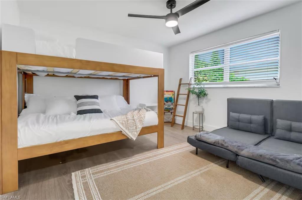 514 14th Street North Naples, FL 34102 - Photo 11 of 22 a bedroom with a large bed and a window