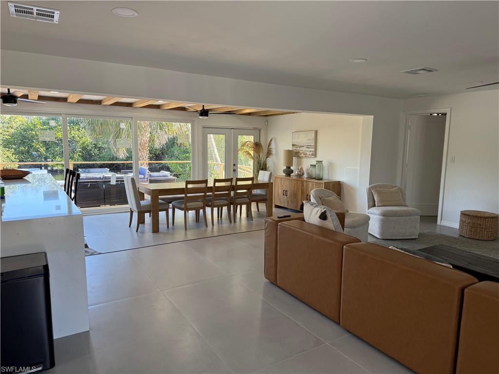 514 14th Street North Naples, FL 34102 - Photo 14 of 22 a living room with furniture and a large window