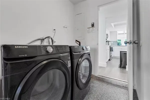 a utility room with dryer and washer