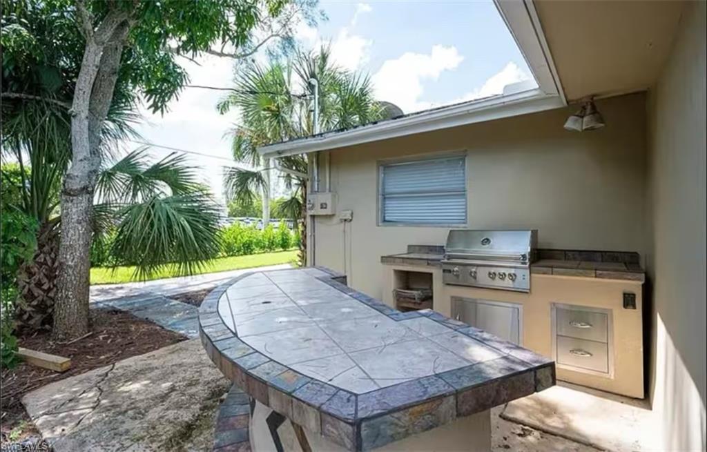 514 14th Street North Naples, FL 34102 - Photo 20 of 22 a white stove top oven and sink