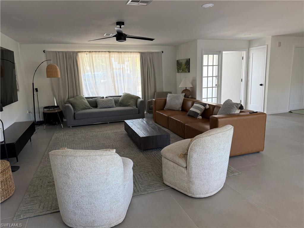 514 14th Street North Naples, FL 34102 - Photo 22 of 22 a living room with furniture and a window