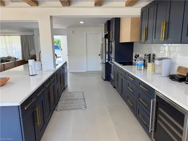 a kitchen with counter top space cabinets and stainless steel appliances