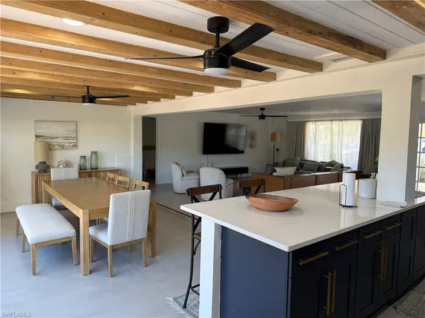 a kitchen with a table chairs and a stove