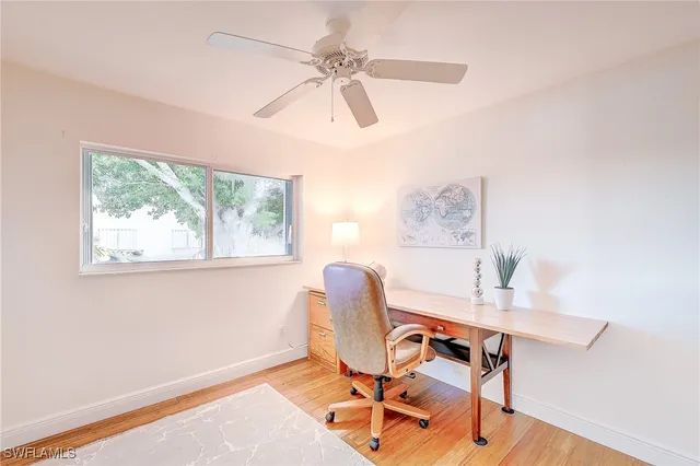 a workspace with furniture and a window