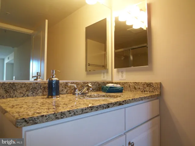 a bathroom with sink and granite
