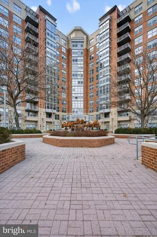a view of buildings with yard