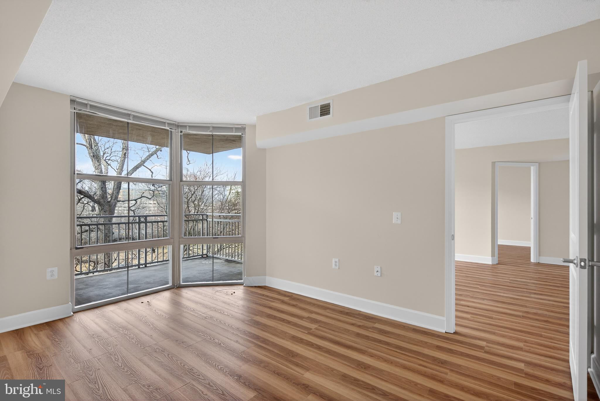 11800 Sunset Hills Road, Unit 608 Reston, VA 20190 - Photo 31 of 40 wooden floor in an empty room with a window