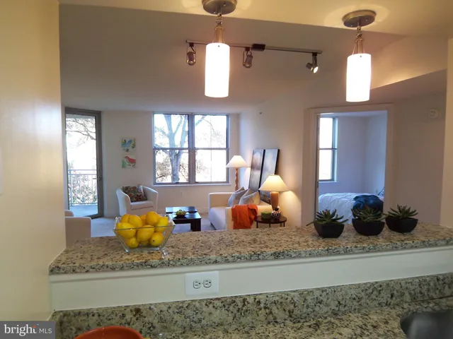 a kitchen with a granite countertop lots of counter top space