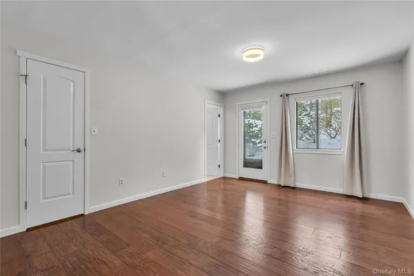 a view of a livingroom with wooden floor