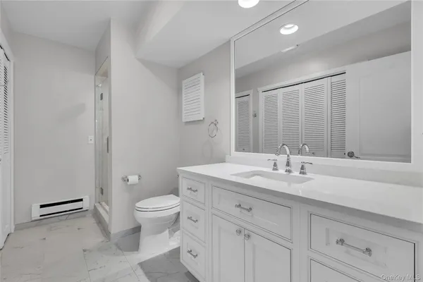 a bathroom with a sink and toilet