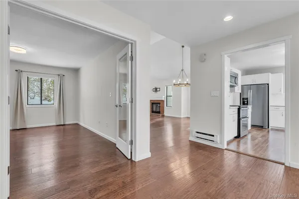 a kitchen with stainless steel appliances a refrigerator and a stove top oven