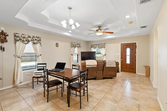 a view of a livingroom with furniture and a chandelier