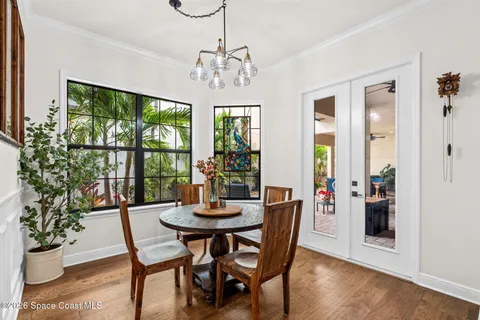 a view of a dining room with furniture window and wooden floor