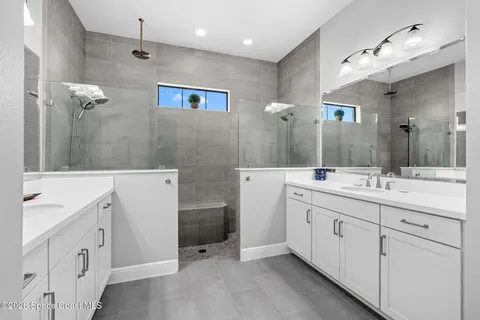 a view of bathroom with dual sinks