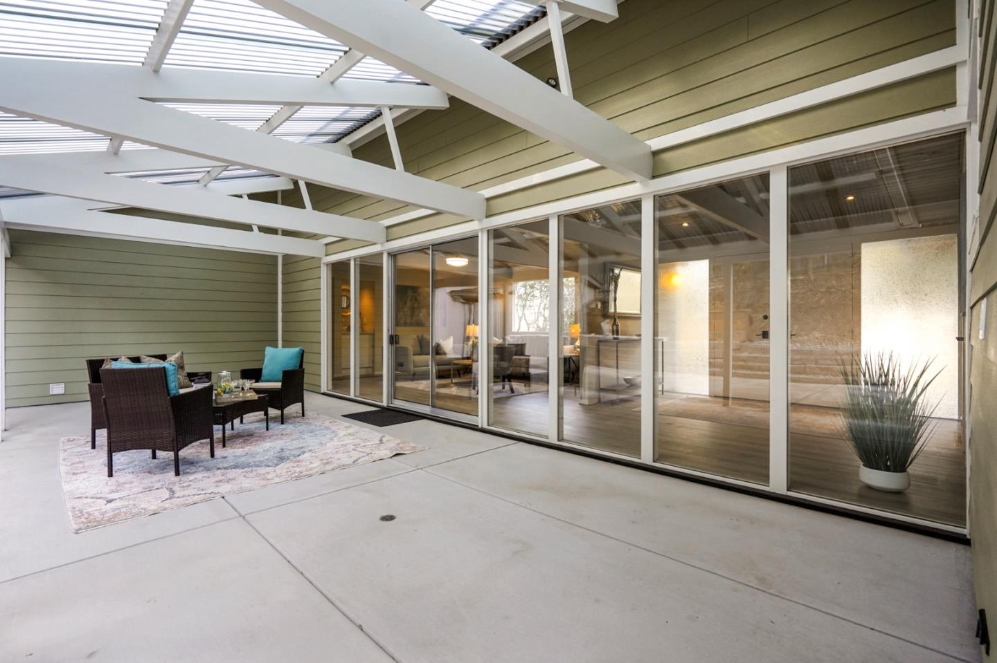 1183 Millbrae Avenue Millbrae, CA 94030 - Photo 35 of 98 a view of a patio with table and chairs and potted plants