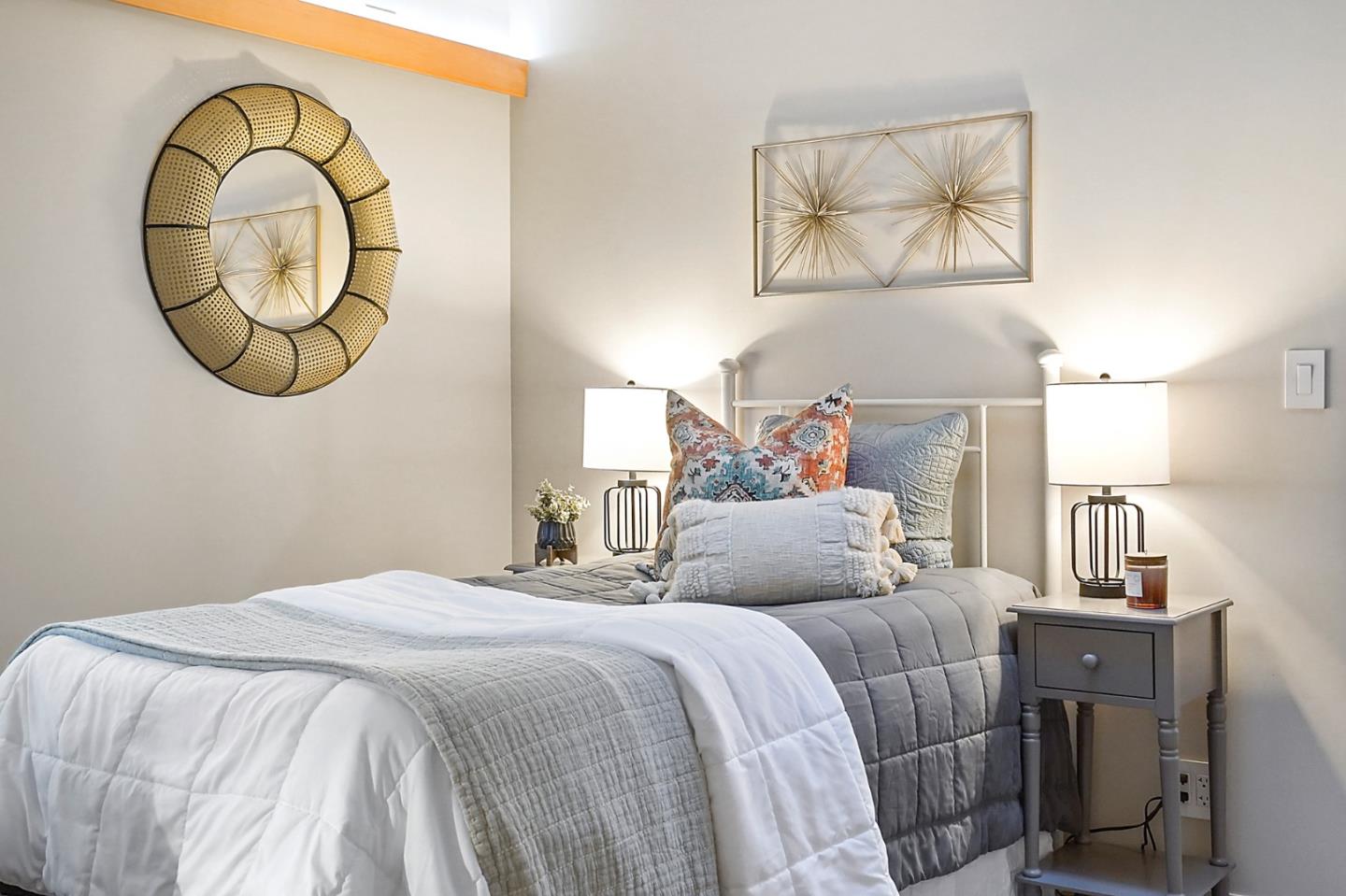 1183 Millbrae Avenue Millbrae, CA 94030 - Photo 46 of 98 a bedroom with a bed and a mirror