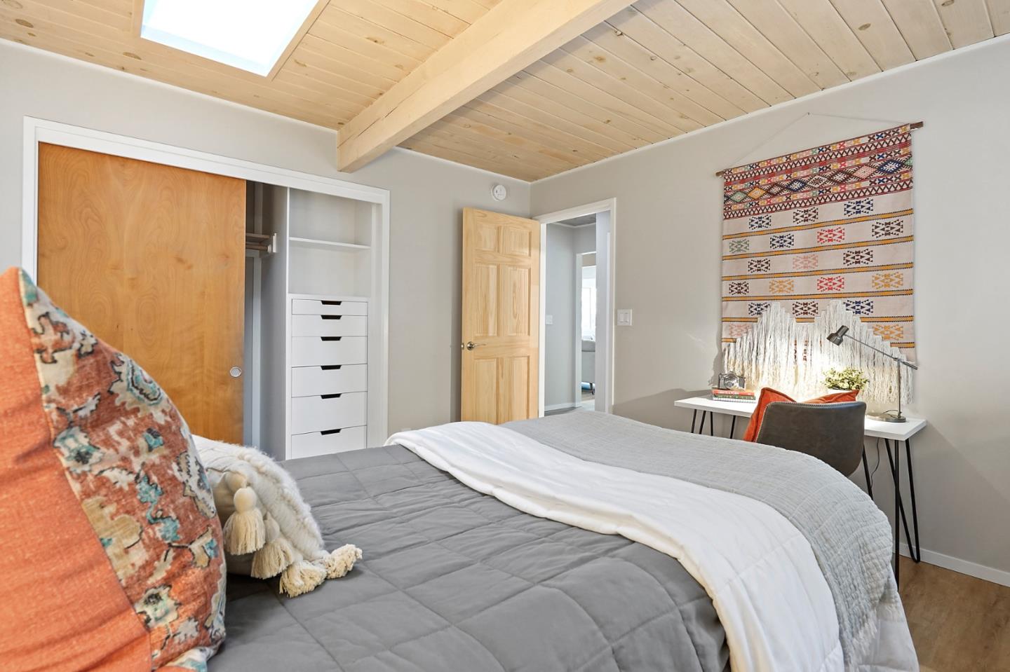 1183 Millbrae Avenue Millbrae, CA 94030 - Photo 47 of 98 a bedroom with a bed and wooden floor