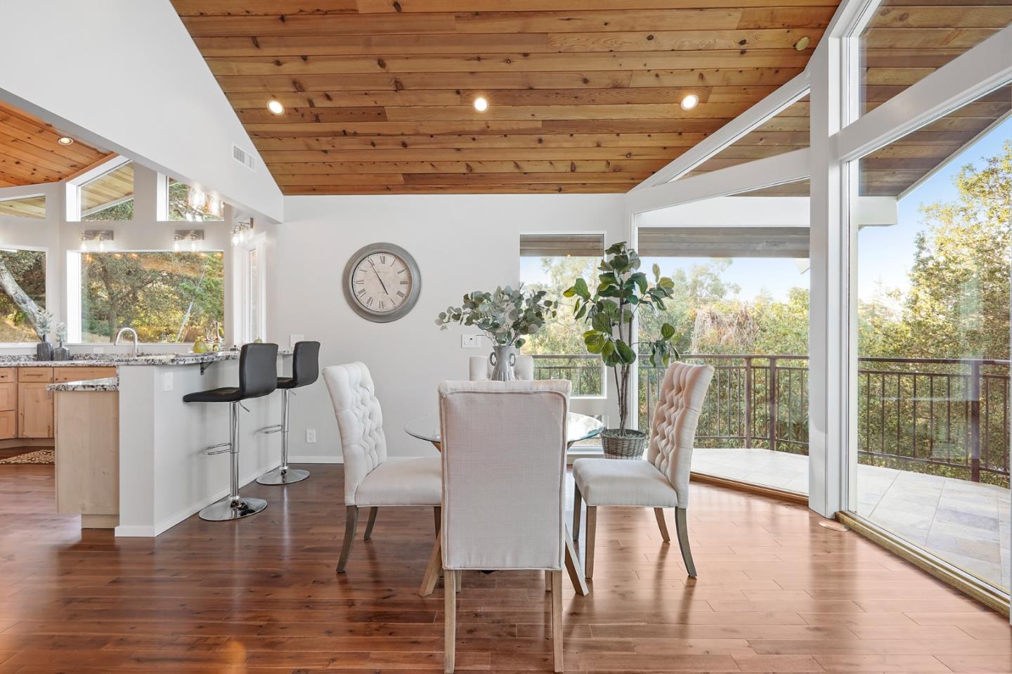1183 Millbrae Avenue Millbrae, CA 94030 - Photo 49 of 98 a dining room with wooden floor a glass table and chairs