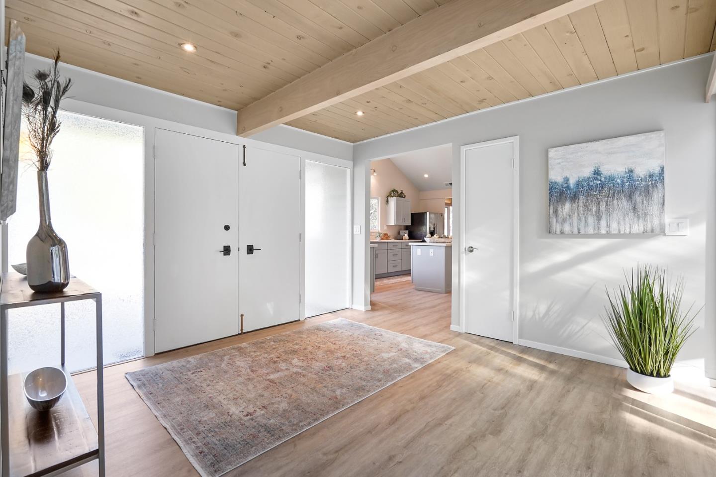 1183 Millbrae Avenue Millbrae, CA 94030 - Photo 5 of 98 a view of a hallway to a livingroom with furniture and a window
