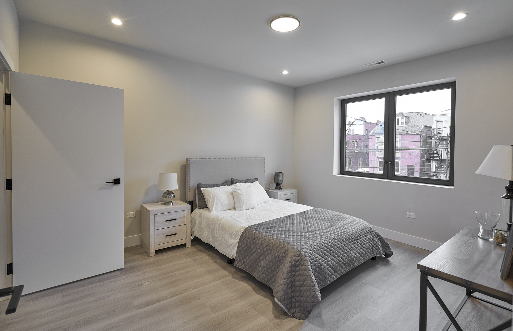 503 East Pershing Road, Unit 503 Chicago, IL 60653 - Photo 21 of 29 a bedroom with a bed and a window