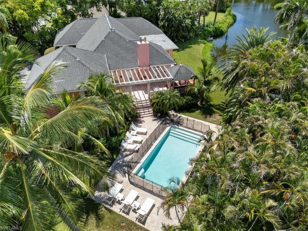 Undisclosed Address Naples, FL 34102 - Photo 1 of 22 an aerial view of a house